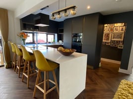 Contemporary style kitchen & dining space with two tone cabinets | Raison Home - 1