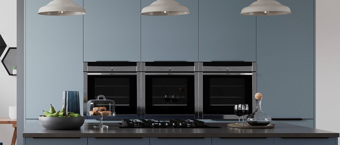 Cropped appliances in blue kitchen