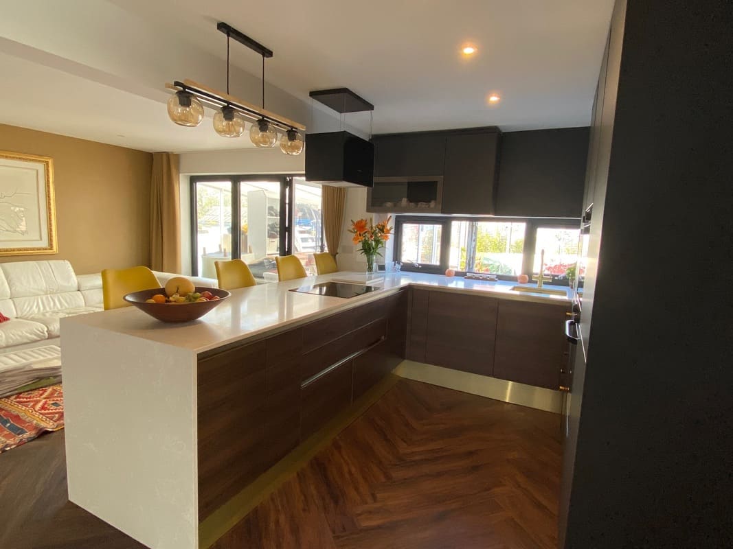 Contemporary style kitchen & dining space with two tone cabinets | Raison Home - 3