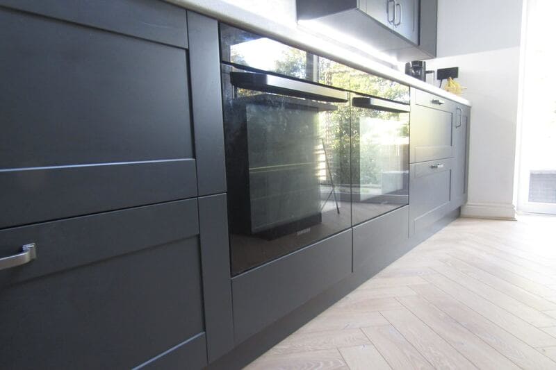 Black kitchen with shaker cabinets in Solihull 6