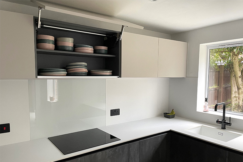 Contemporary style kitchen & dining space with two tone cabinets in Daventry 1