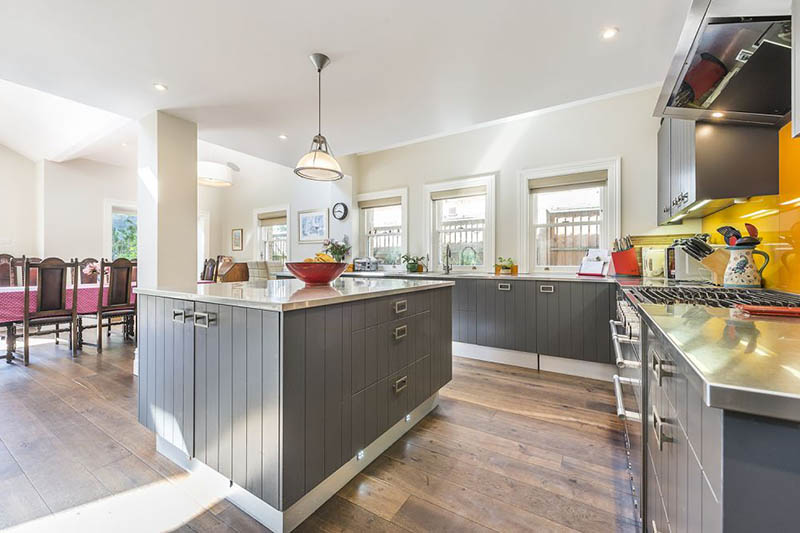 A Pop of Orange for this open kitchen by Tess Stobie 4