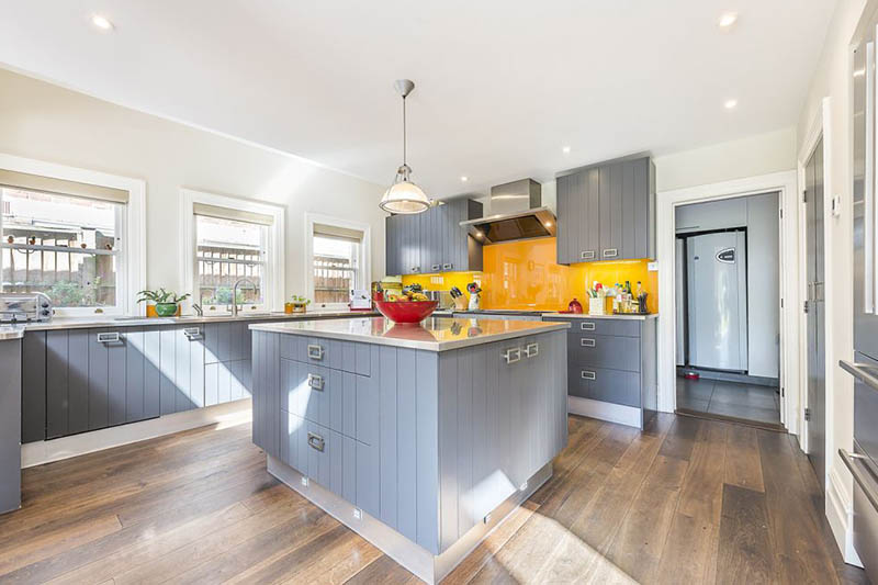 A Pop of Orange for this open kitchen by Tess Stobie 1