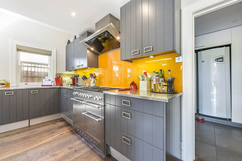 A pop of orange for this open kitchen by Tess Stobie | Raison Home - 2