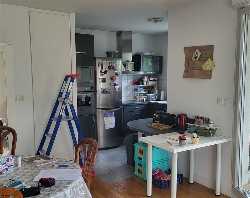 Cuisine ouverte bois et beige à Basse Goulaine | Raison Home - 7